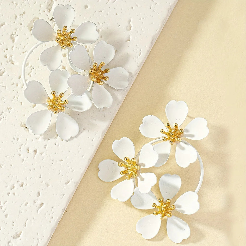 Retro flower-shaped earrings for women in black or white with iron construction.
