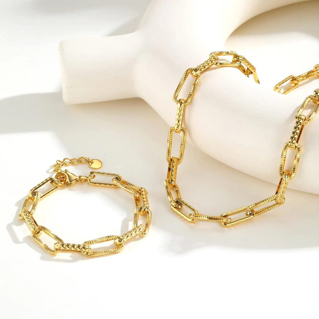 Gold electroplated titanium steel bracelet and necklace set with embossed rectangular geometric design for women