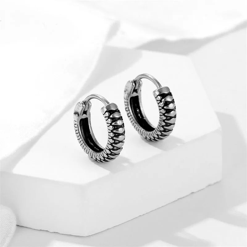 Silver stainless steel retro twist earrings with geometric striped pattern and round elements