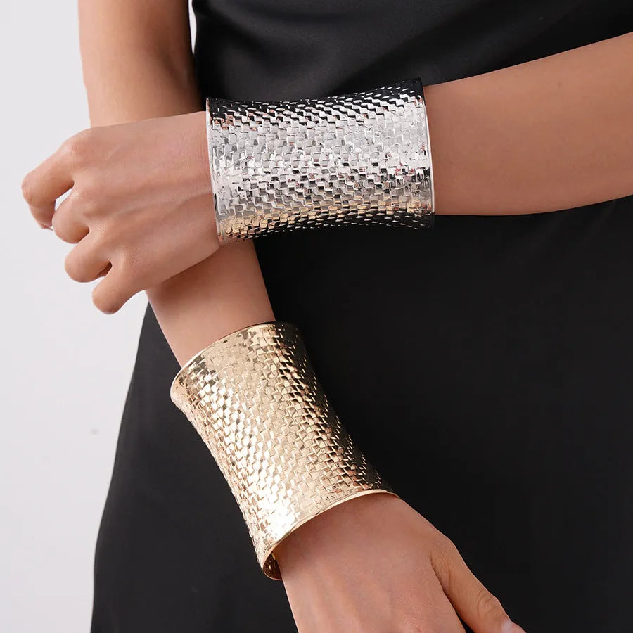 Women's vintage exaggerated personalised bracelet with round gold charm measuring 6.5 by 9.7 centimetres