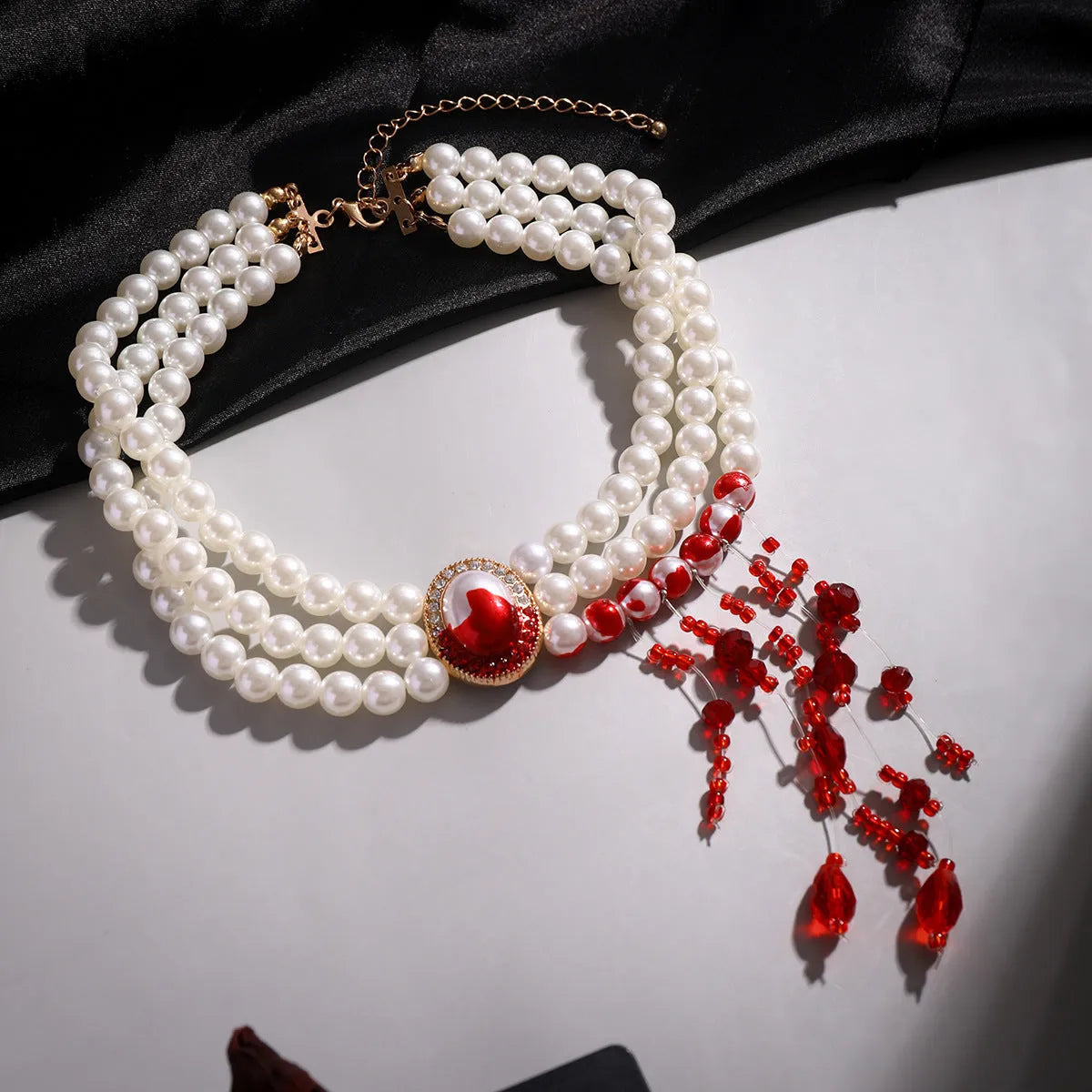 Halloween jewellery set with pearl collar necklace, bracelet, and stud earrings in electroplated gold finishes