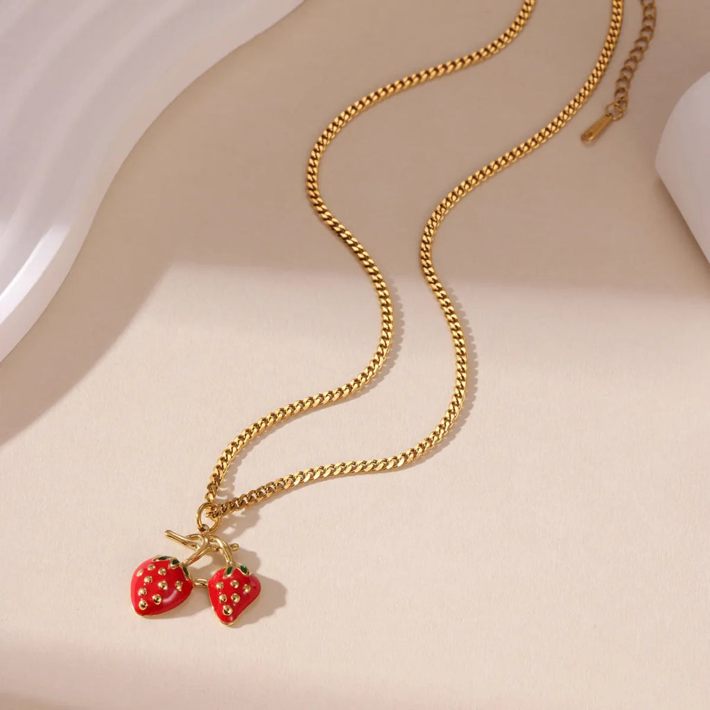 Stainless steel strawberry pendant necklace on an alloy chain, shown in red and white gradient colour options.