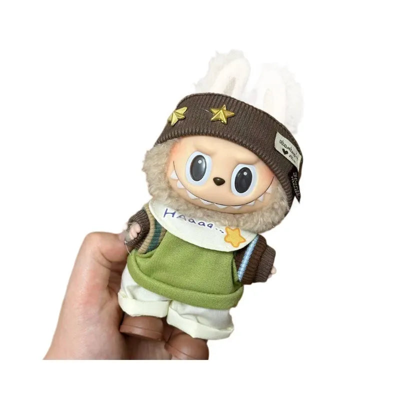 Plastic clothing costume for a 17cm tall vinyl doll figurine on display.