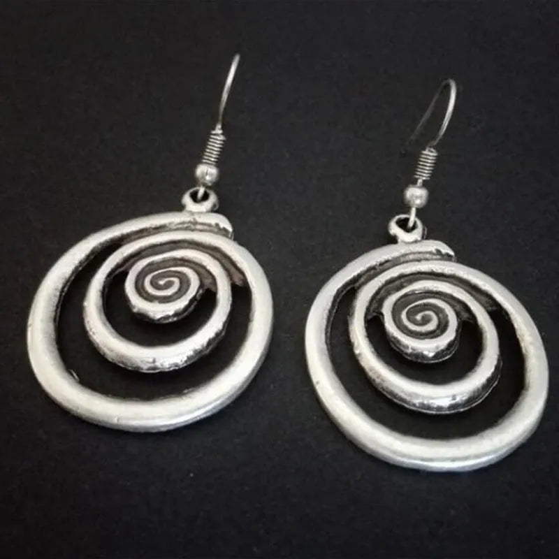 Silver geometric spiral distressed earrings with retro design measuring 2.6 by 5 centimetres