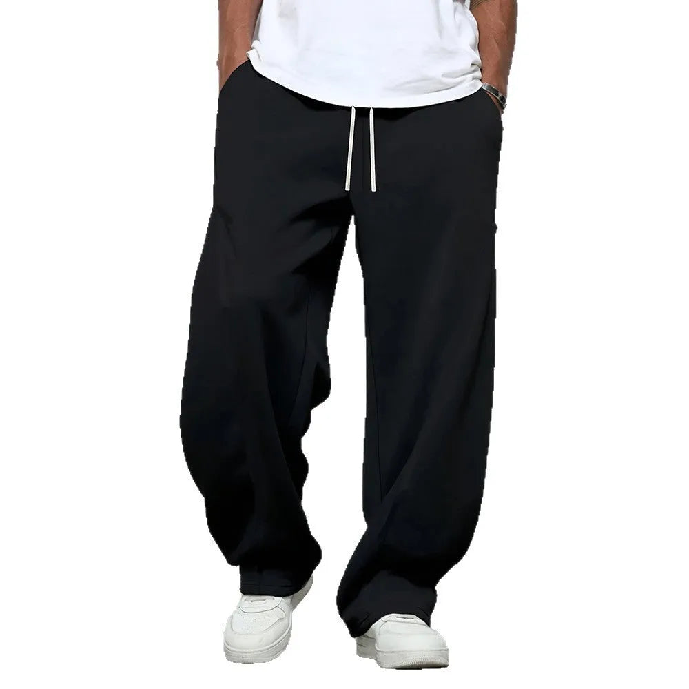Men's straight-leg casual trousers in black with a drawstring waistband