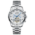 Men's silver automatic perpetual calendar watch with stainless steel strap on a wrist.