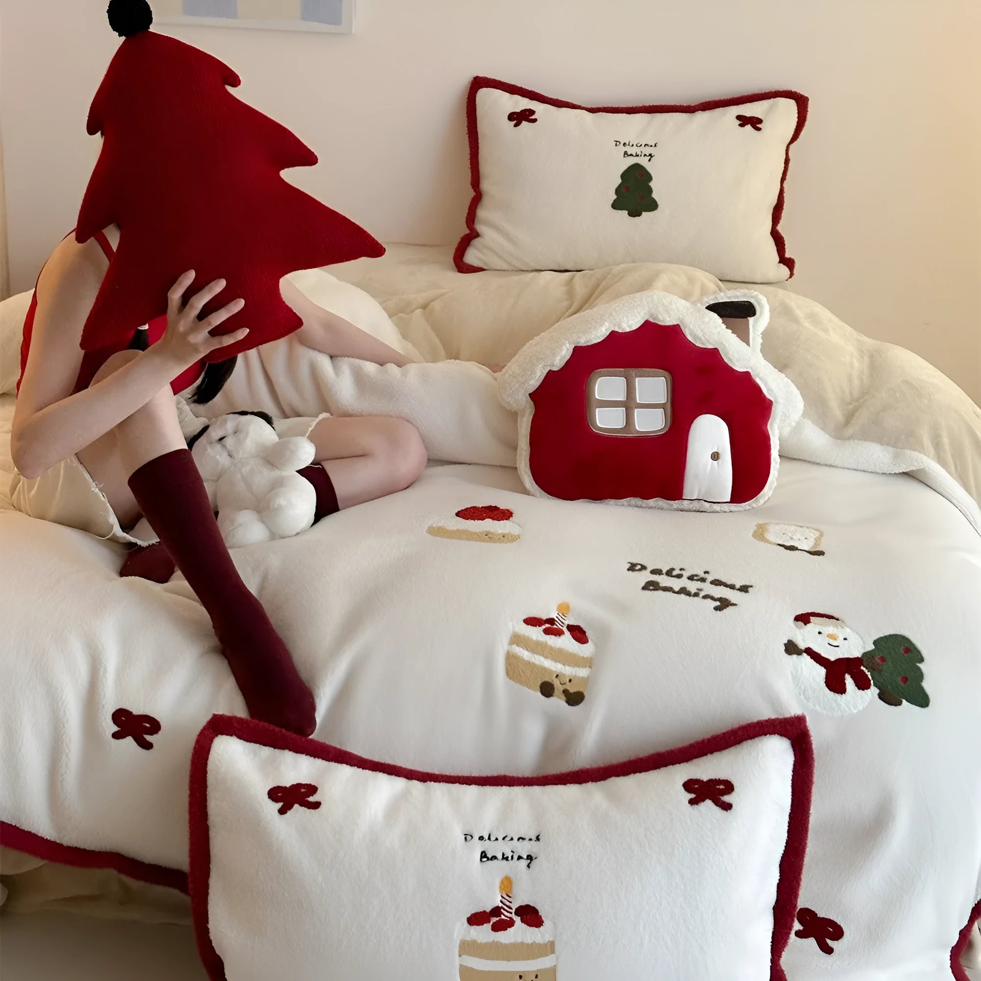 Winter Christmas cartoon cashmere bedding four-piece set shown on bed with duvet cover and pillowcases