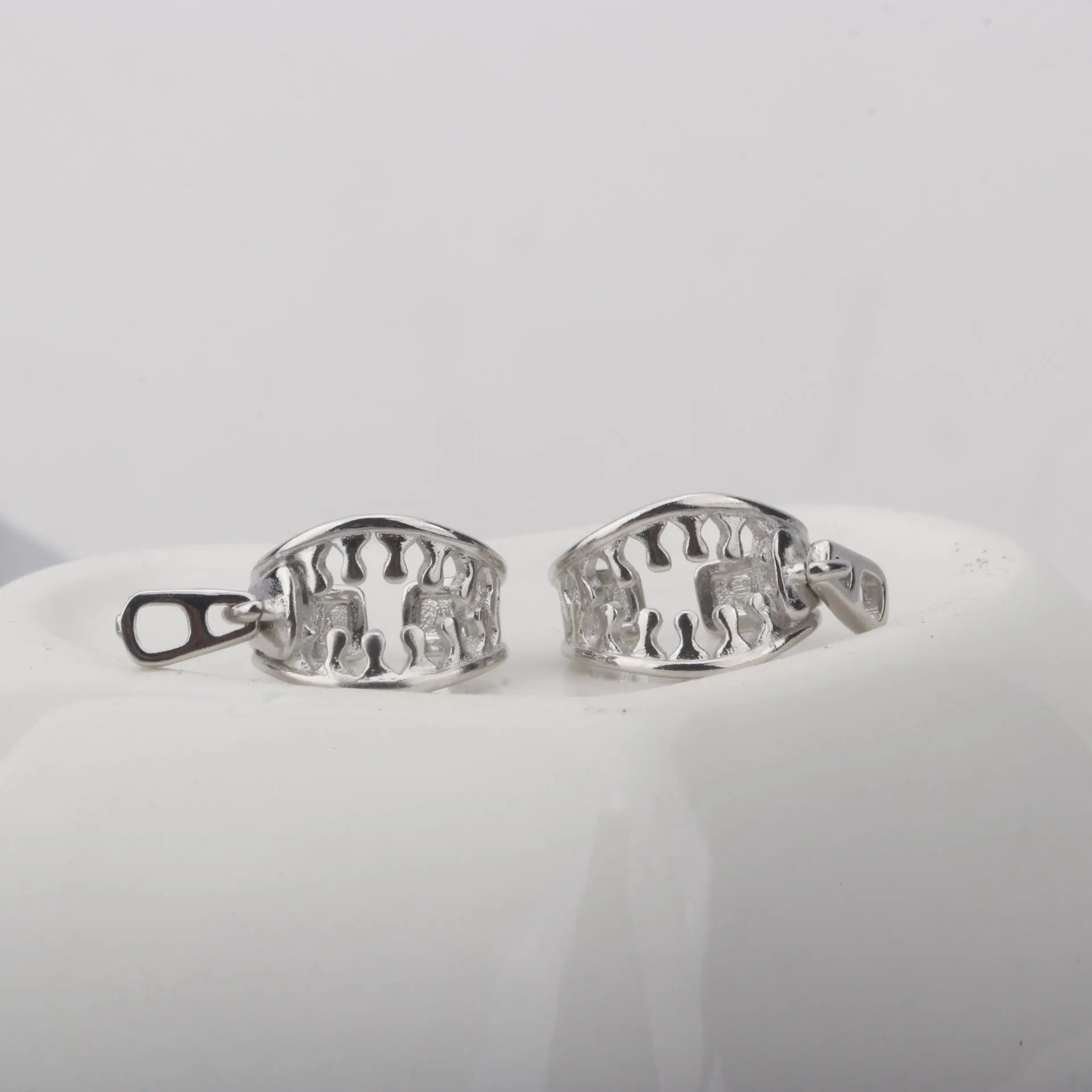 A pair of geometric copper clip-on earrings with linear design in ES862 colour.