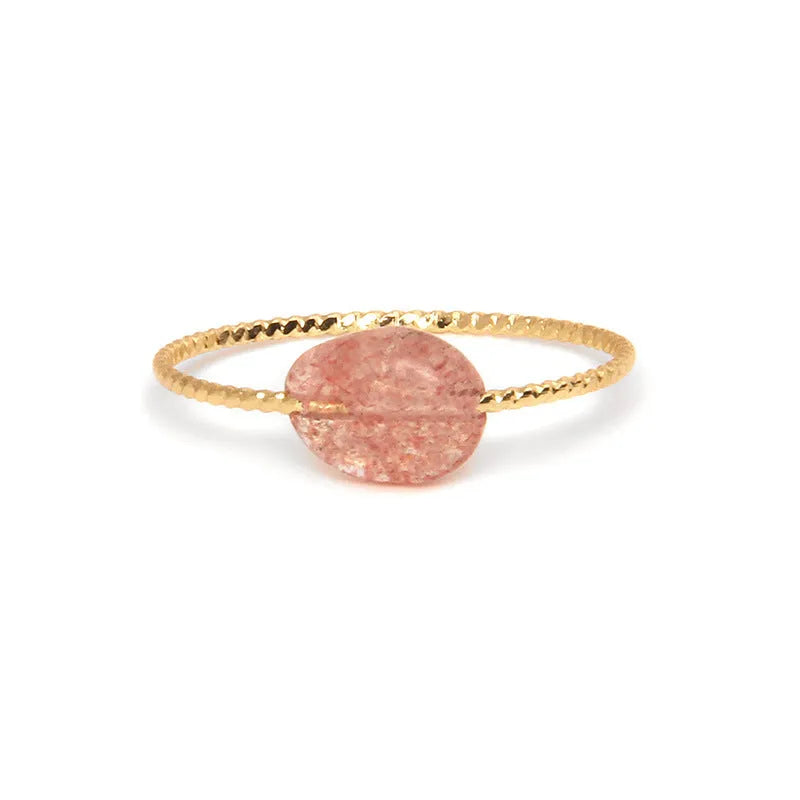 Geometric silver-tone ring with a coloured agate stone in a niche design, side view.