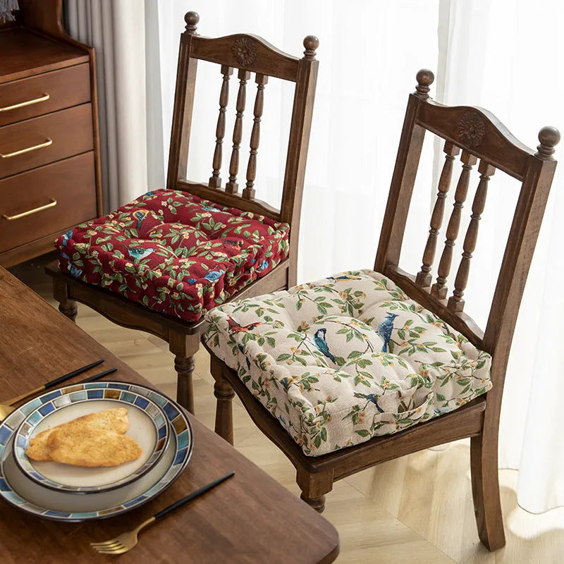Square American-style dining chair cushion with pp cotton filler, shown in apricot floral bird print.