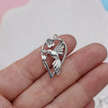 Close-up of a detailed alloy cuckoo bird charm pendant with electroplated finish in colour P234.