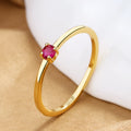 Women's geometric circle ring with single diamond in copper, showing colour options