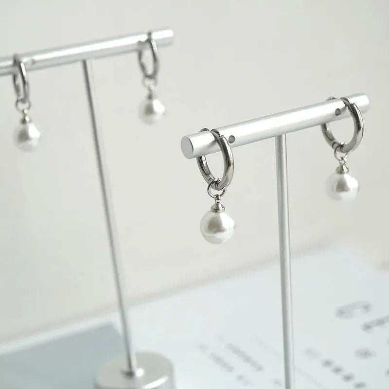 Women's geometric alloy drop earrings with round pearl centre and titanium steel posts in hip hop style