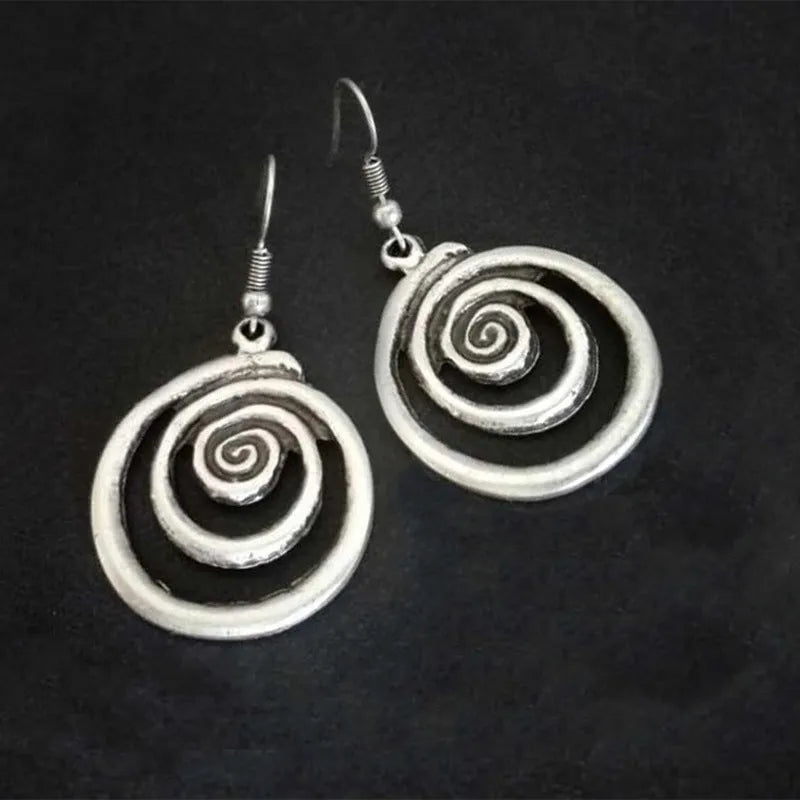 Silver geometric spiral distressed earrings with retro design measuring 2.6 by 5 centimetres