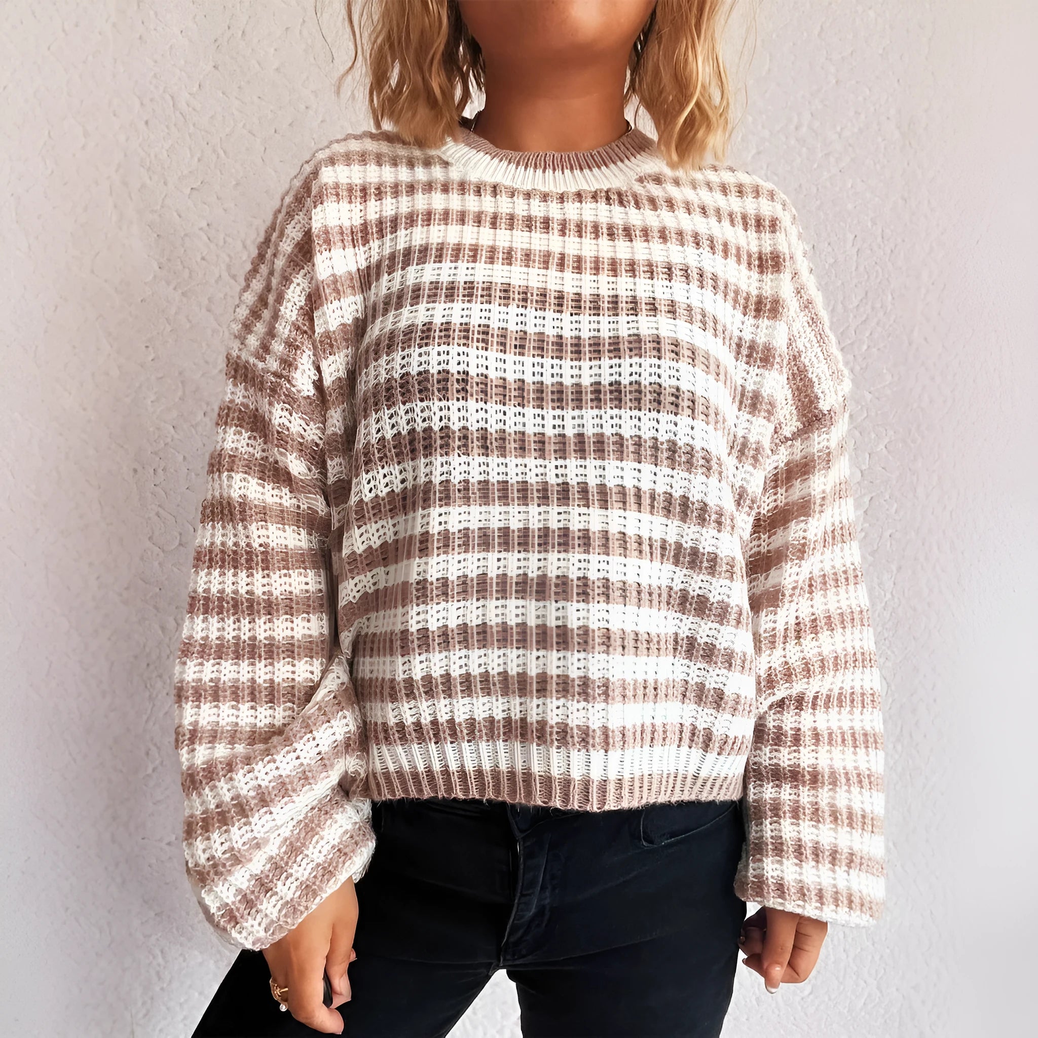 Vintage stripe women's loose fit pullover sweater in red, shown with long sleeves and a round neck.