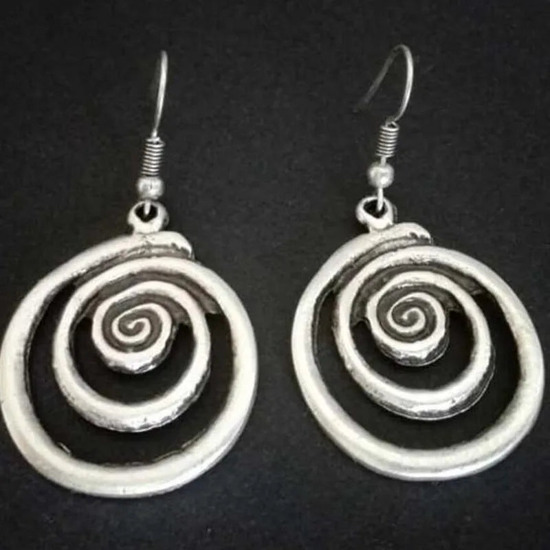 Silver geometric spiral distressed earrings with retro design measuring 2.6 by 5 centimetres