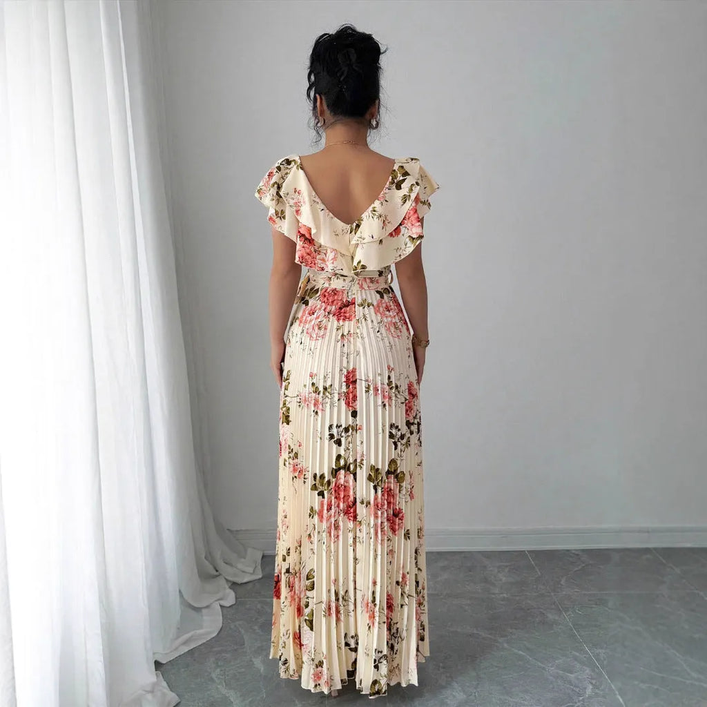 Apricot coloured V-neck dress with digital floral print, ruffled sleeves, and an oversized swing skirt.