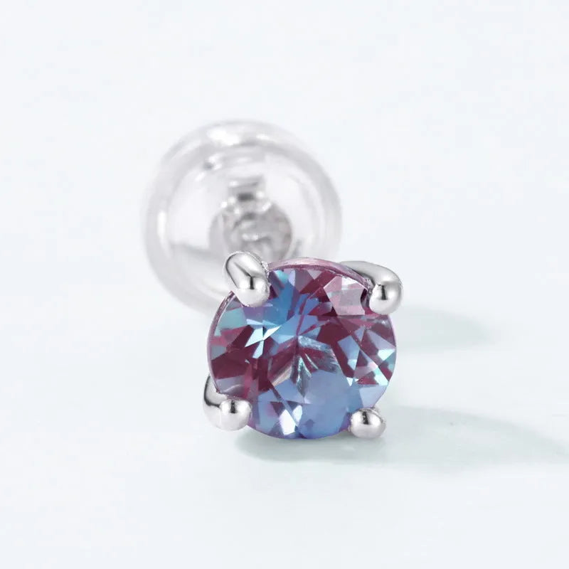A pair of geometric 925 silver ear studs featuring a cultivated Alexandrite stone.