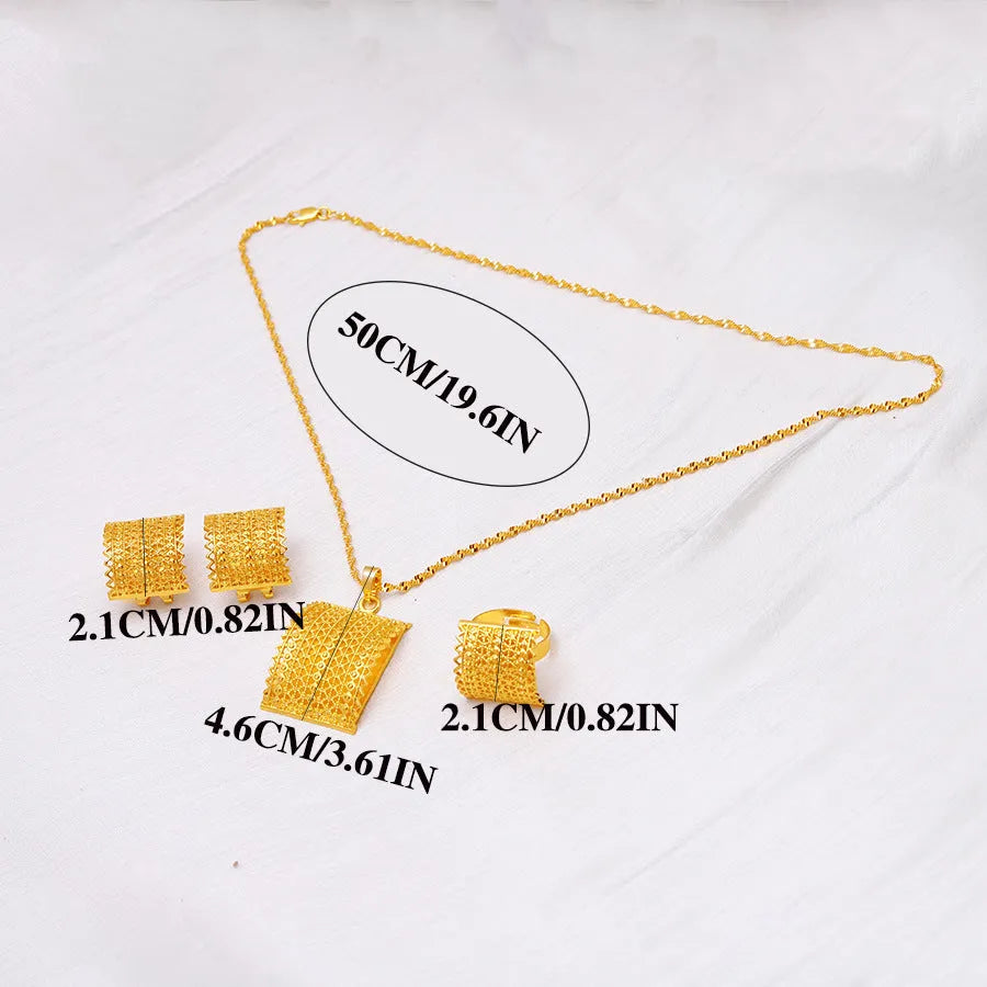 Golden copper bridal jewellery set showing necklace, earrings, and ring on a display.