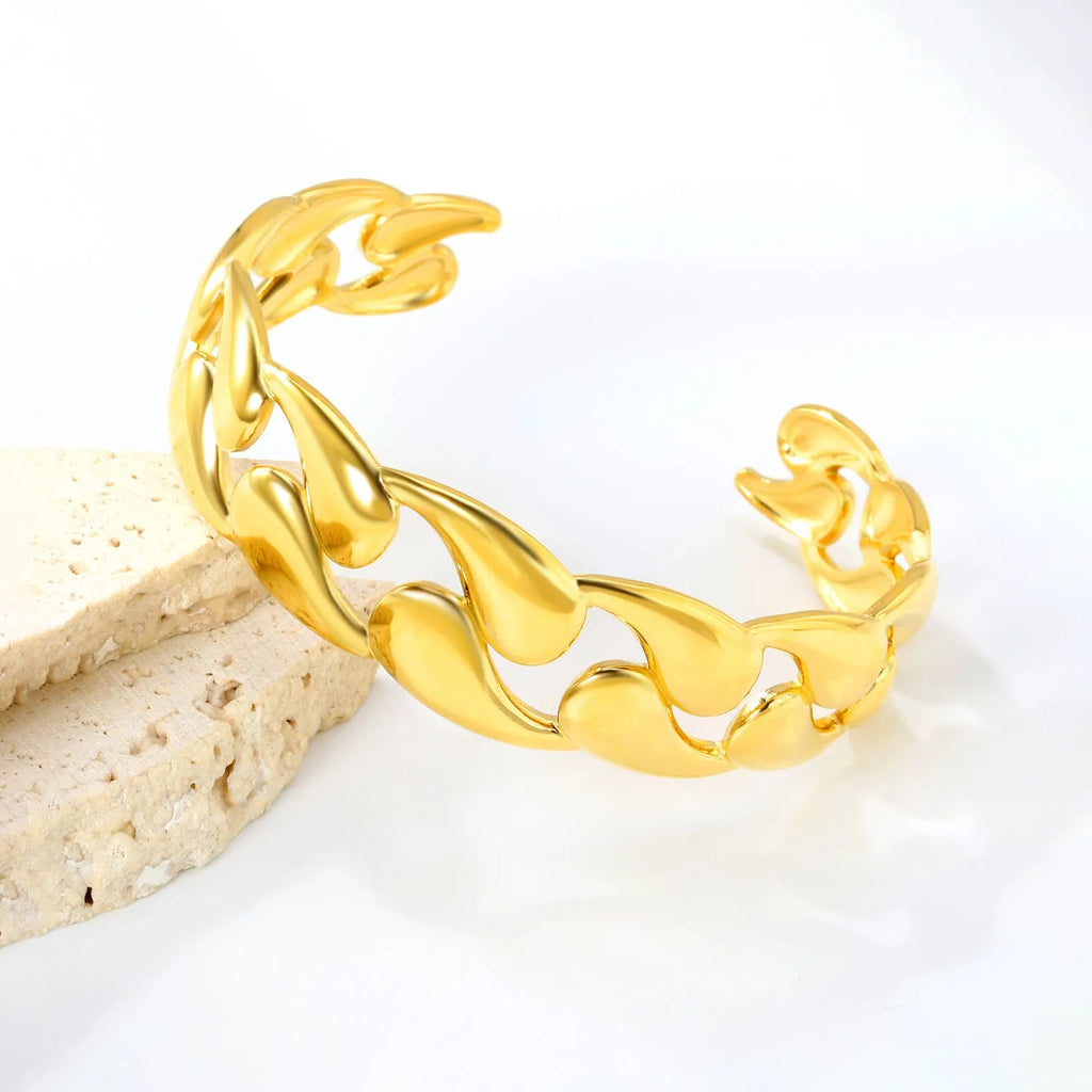 Stainless steel alloy bracelet in gold or silver tone for European American trend styling.