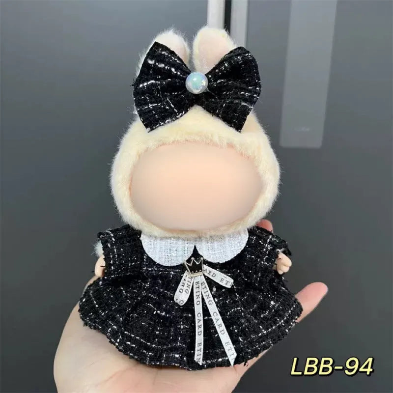 Plastic clothing costume for a 17cm tall vinyl doll figurine on display.