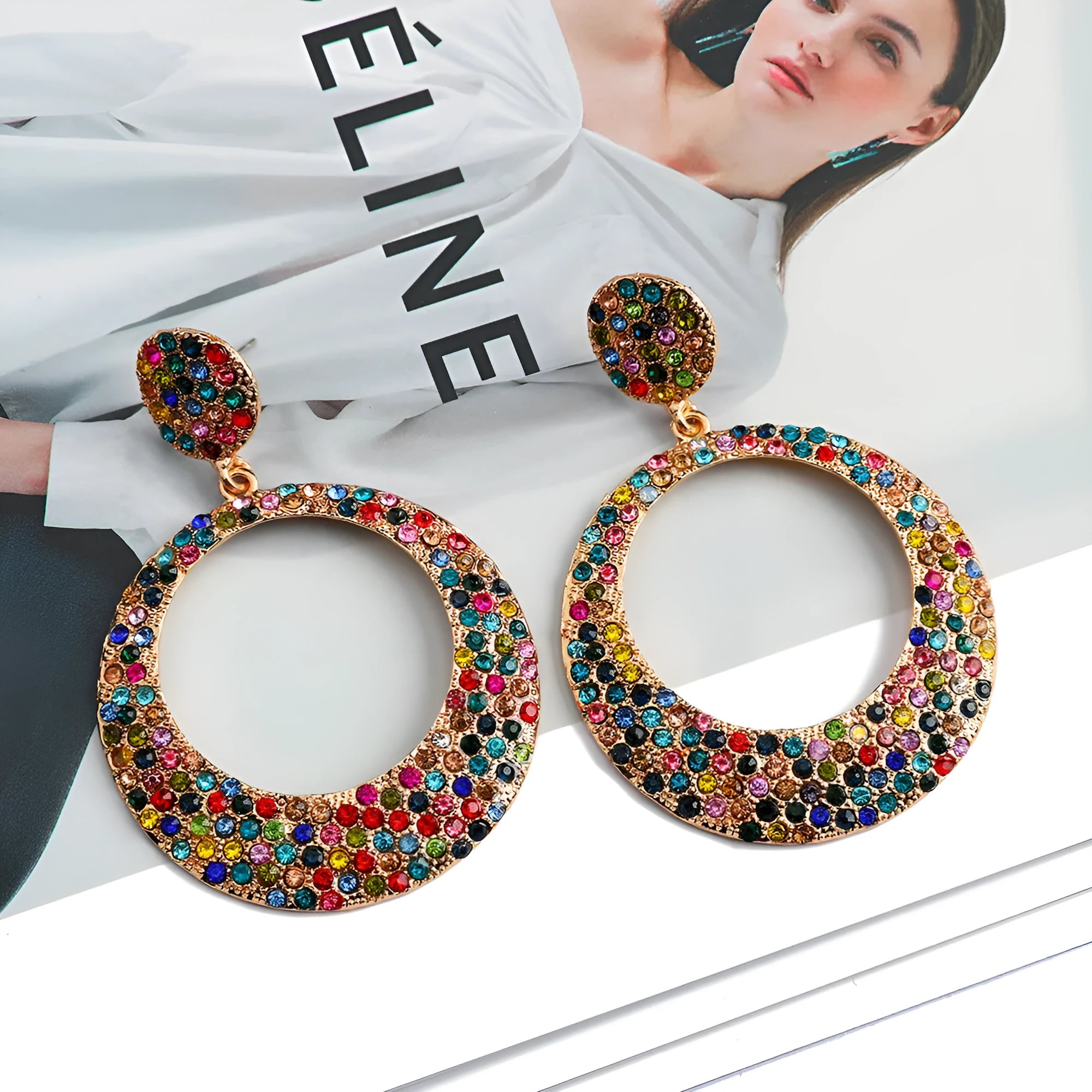 A pair of large colourful alloy pendant earrings with a diamond-shaped round cartoon design.