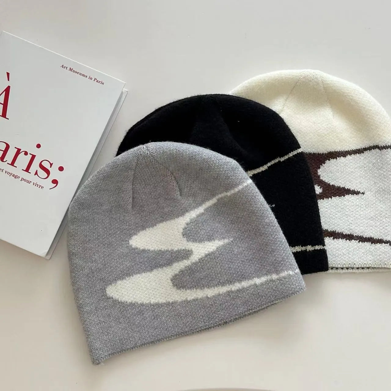 Acrylic knitted beanie hat in black, grey, or white for men and women with 56-58cm size