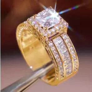 Geometric silver-toned women's ring with a round design element on a hand.