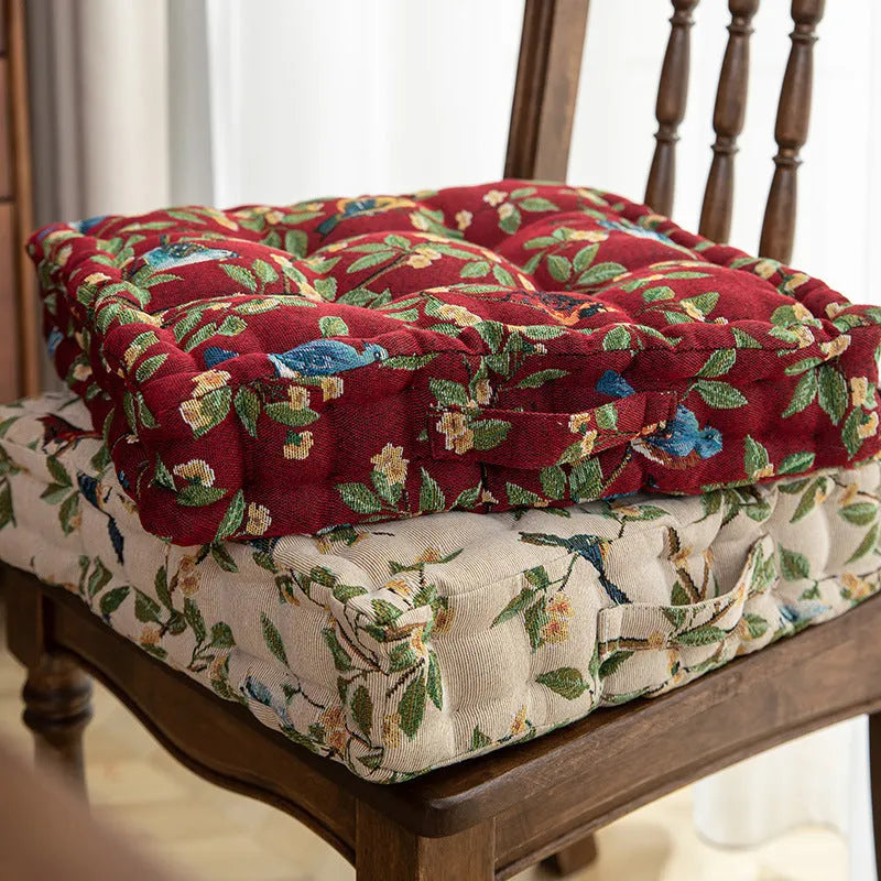 Square American-style dining chair cushion with pp cotton filler, shown in apricot floral bird print.