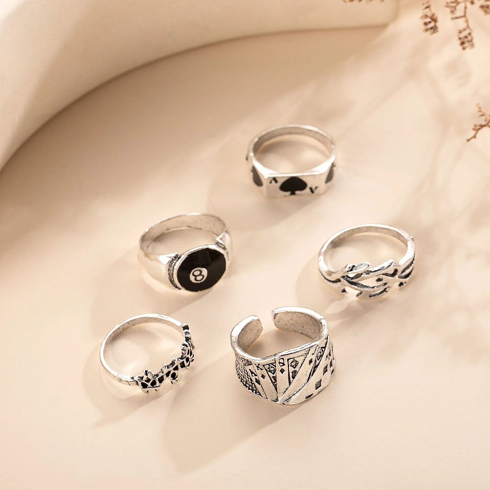 Black alloy poker ring with retro spade card design showing adjustable sizing feature