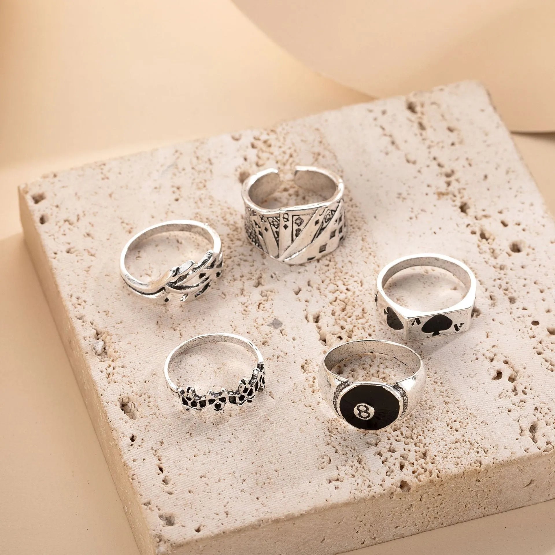Black alloy poker ring with retro spade card design showing adjustable sizing feature
