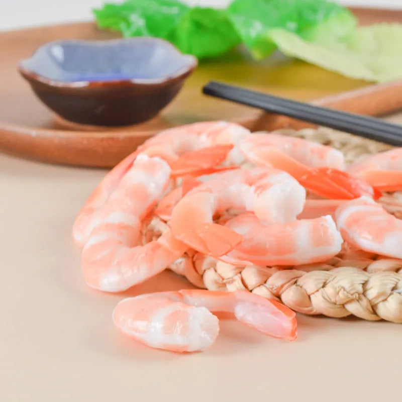 PVC simulation shrimp-shaped novelty keychain with door buckle, shown in modern simplicity style.
