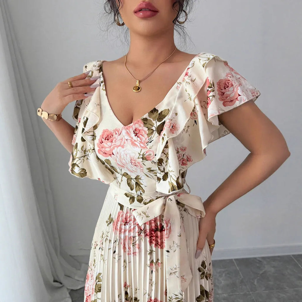 Apricot coloured V-neck dress with digital floral print, ruffled sleeves, and an oversized swing skirt.