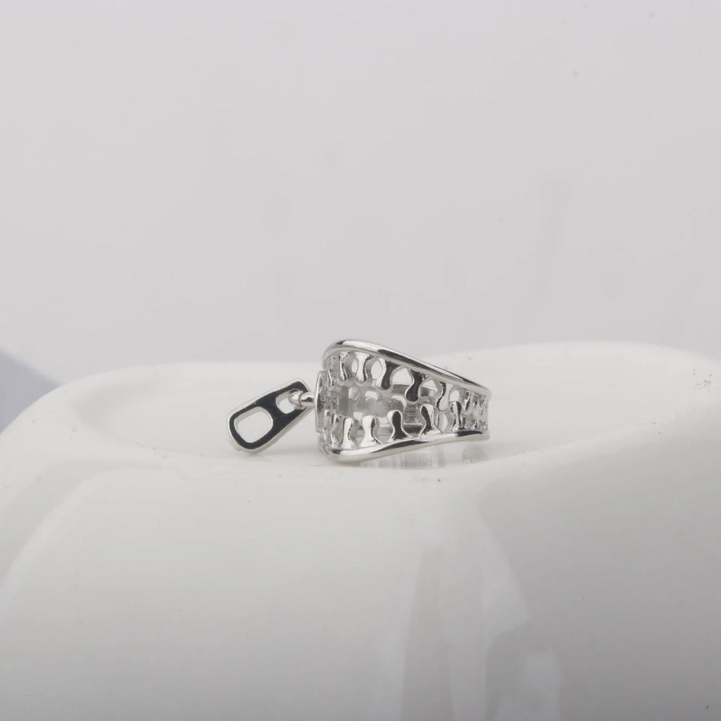 A pair of geometric copper clip-on earrings with linear design in ES862 colour.
