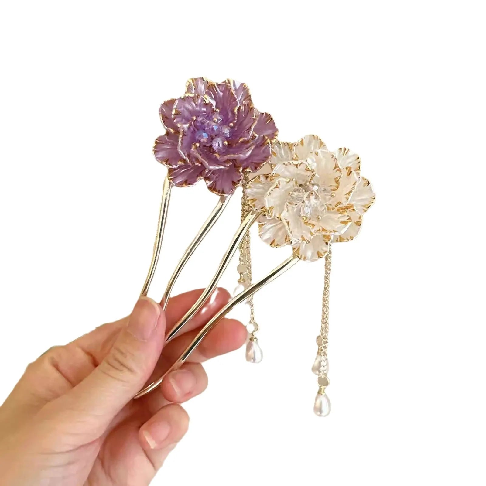 Close-up of a purple alloy U-shaped hairpin with a detailed peony flower and tassel design on a white background.