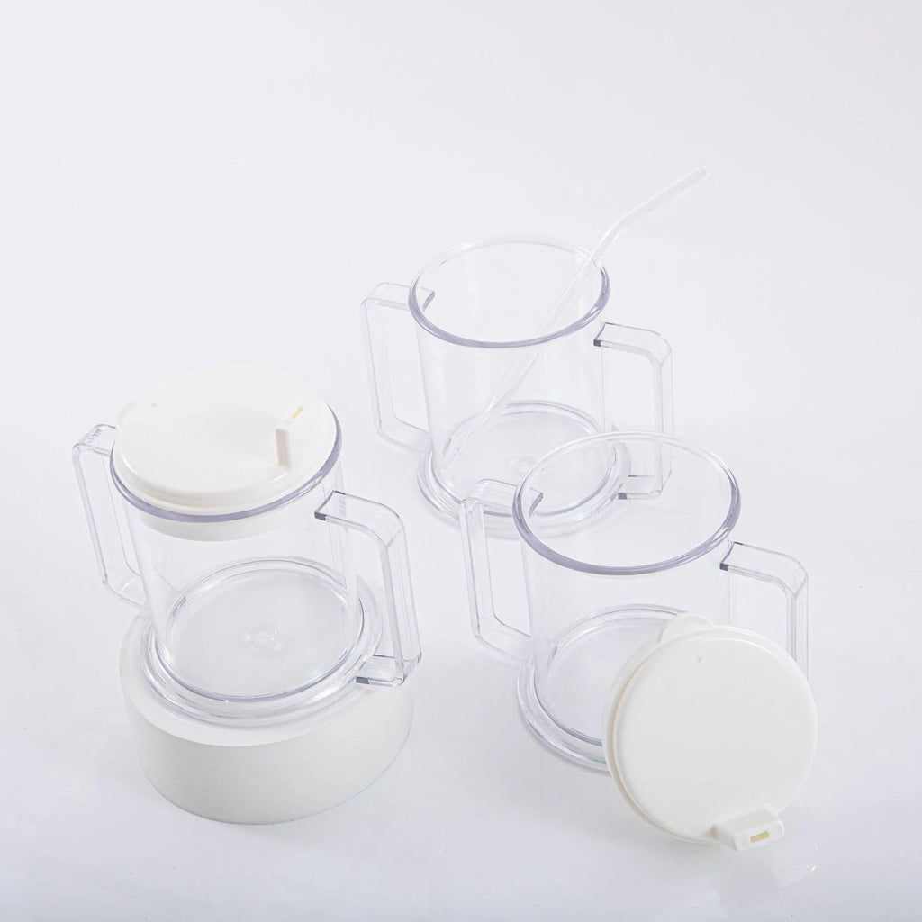 Transparent plastic drinking cup with a grey spill-proof lid on a white background.