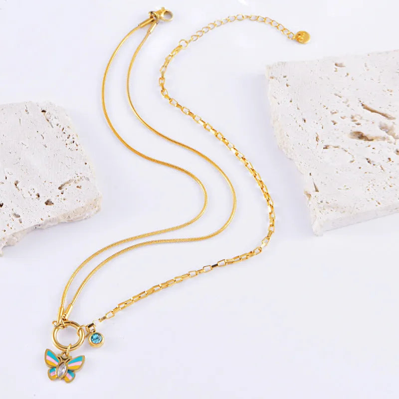 Gold-plated epoxy butterfly necklace and bracelet set with titanium steel construction and snake bone chain links