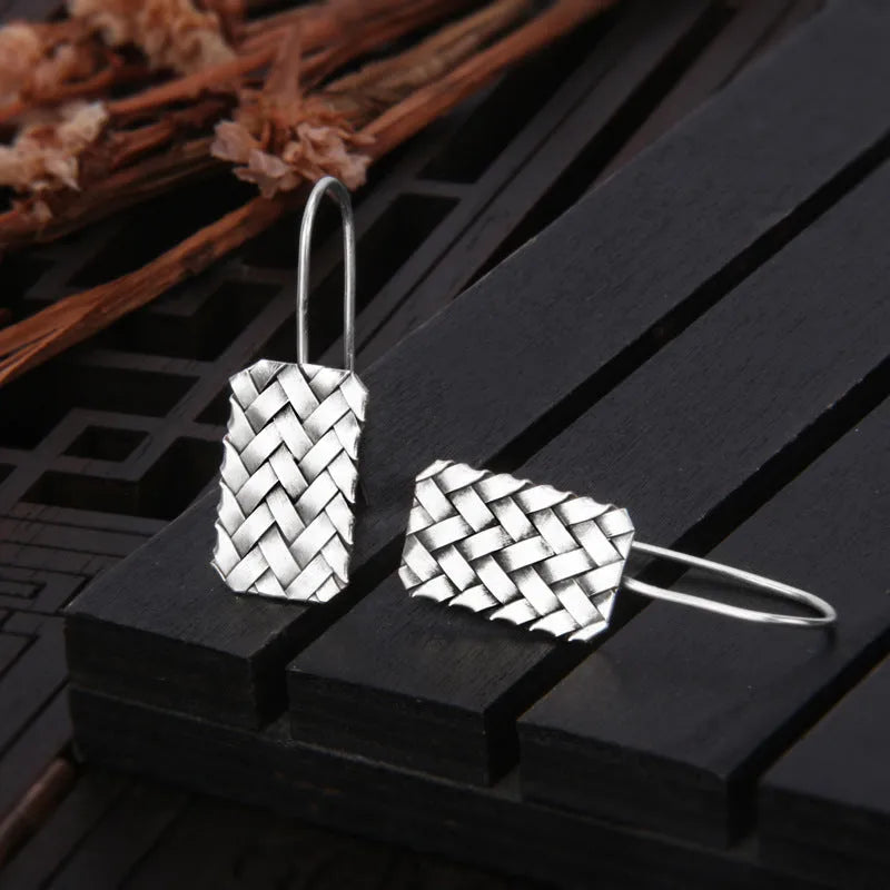 Silver geometric earrings with woven diamond plaid pattern, 17.5mm x 11mm dimensions