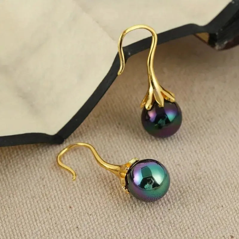 A pair of gold-coloured retro fashion alloy earrings for women with an electroplated finish.