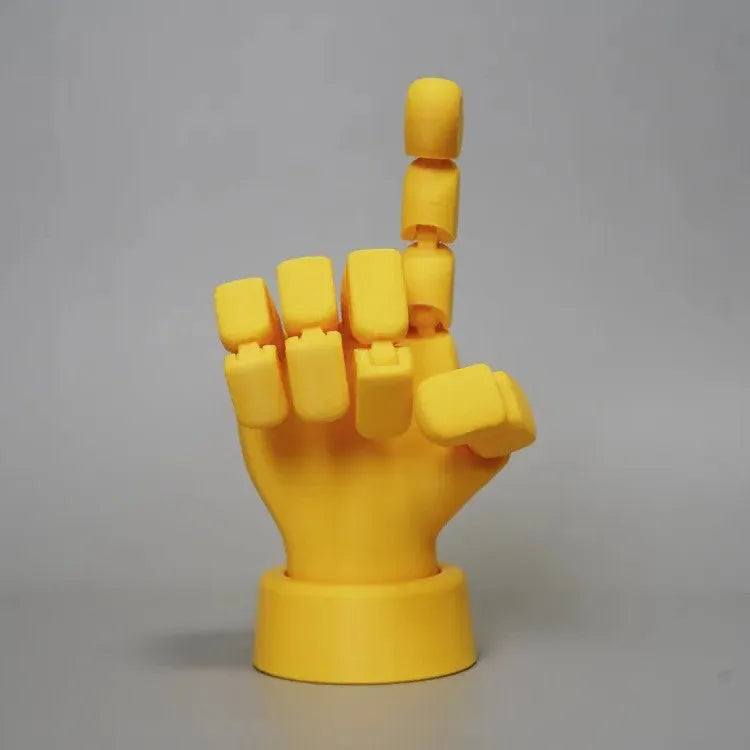 Yellow American-style hand prop figurine with movable joints on a white background