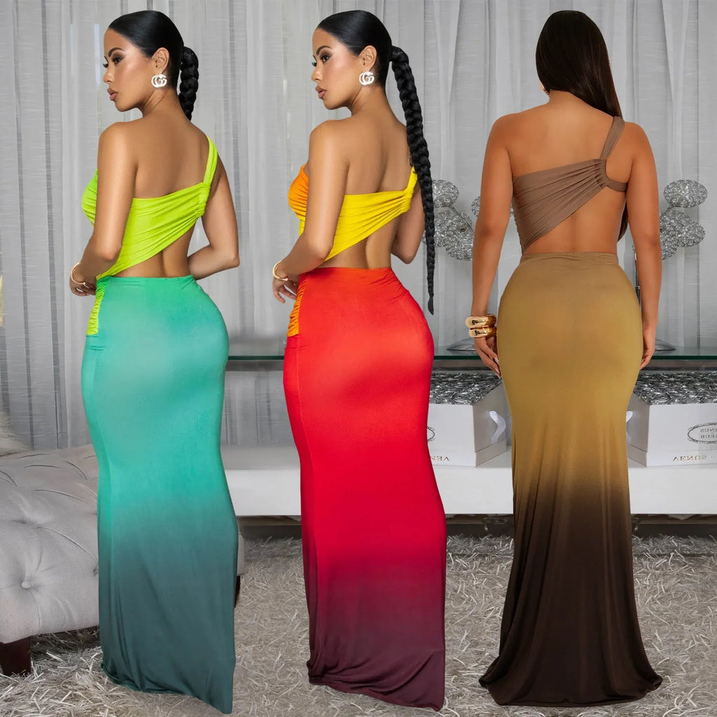 A woman's sleeveless cross-shoulder dress with a gradient colour long skirt.