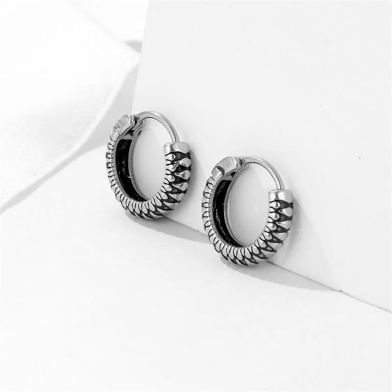 Silver stainless steel retro twist earrings with geometric striped pattern and round elements