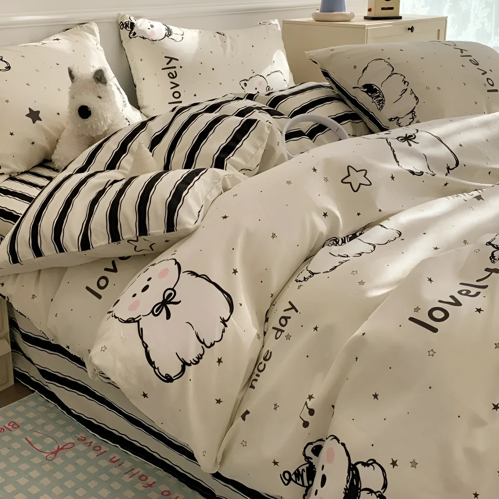 Cartoon dog pattern pure cotton four-piece bedding set shown on a bed, includes multiple size options.