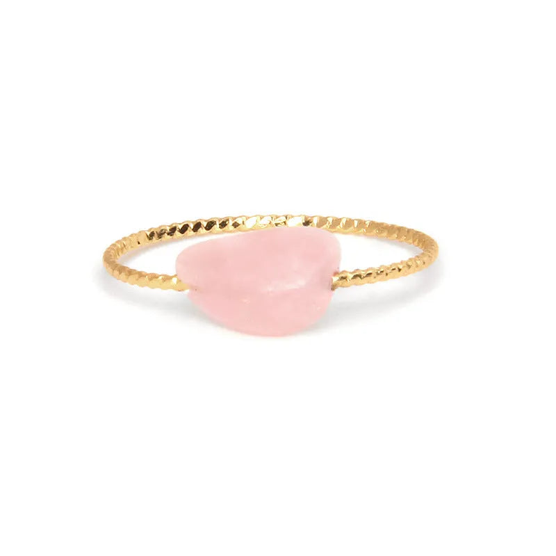 Geometric silver-tone ring with a coloured agate stone in a niche design, side view.