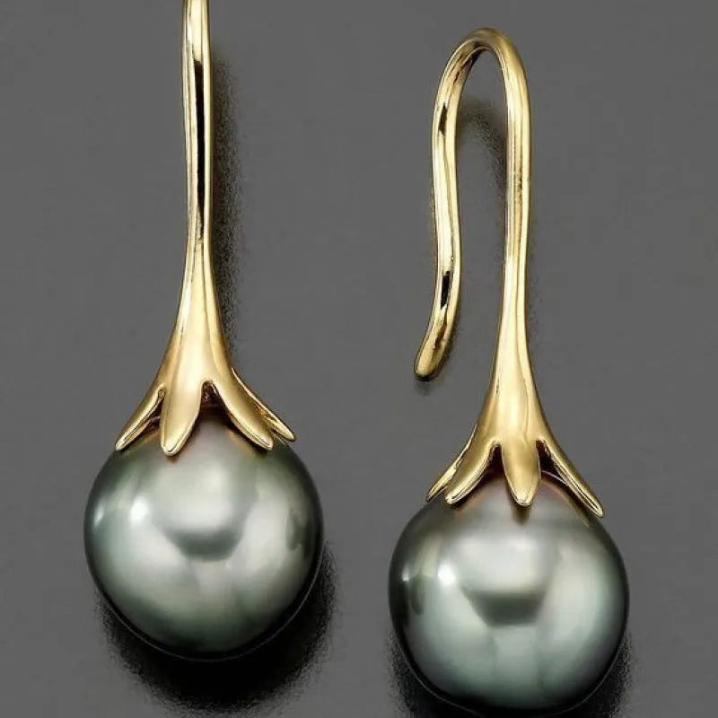 A pair of gold-coloured retro fashion alloy earrings for women with an electroplated finish.