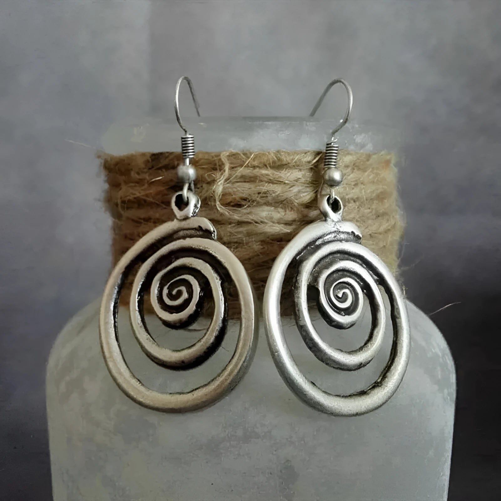 Silver geometric spiral distressed earrings with retro design measuring 2.6 by 5 centimetres