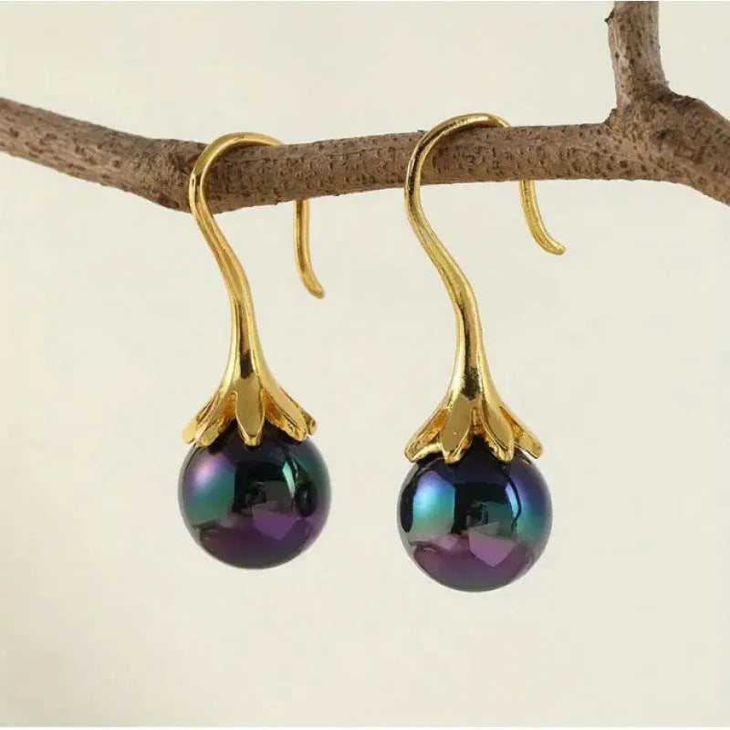 A pair of gold-coloured retro fashion alloy earrings for women with an electroplated finish.