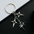Retro metal alloy keychain with four eight-pointed stars in Q53 colour