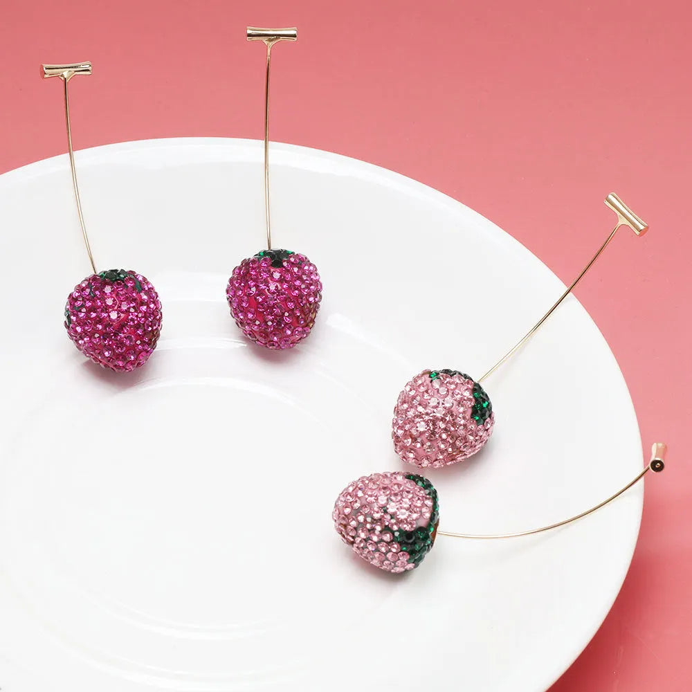 Red strawberry charm stud earrings with spot drill finish on zinc alloy.