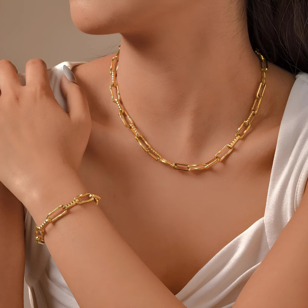 Gold electroplated titanium steel bracelet and necklace set with embossed rectangular geometric design for women